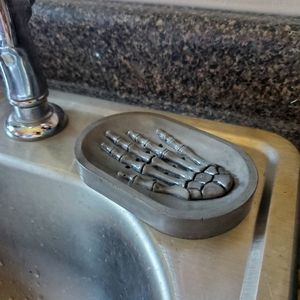 Concrete skeleton hand soap dish